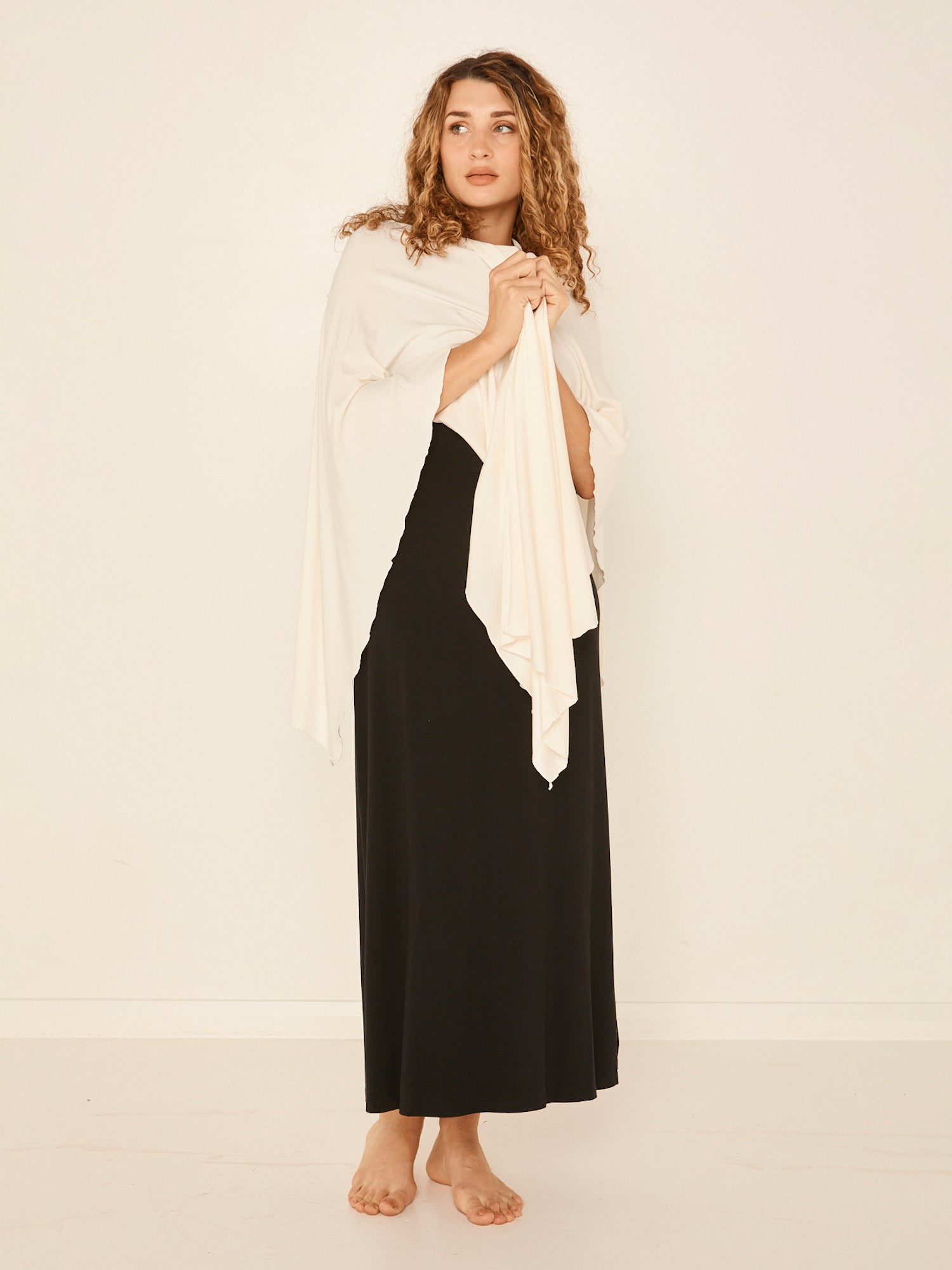 Model wearing cream large nourishing wrap, women's bamboo clothing