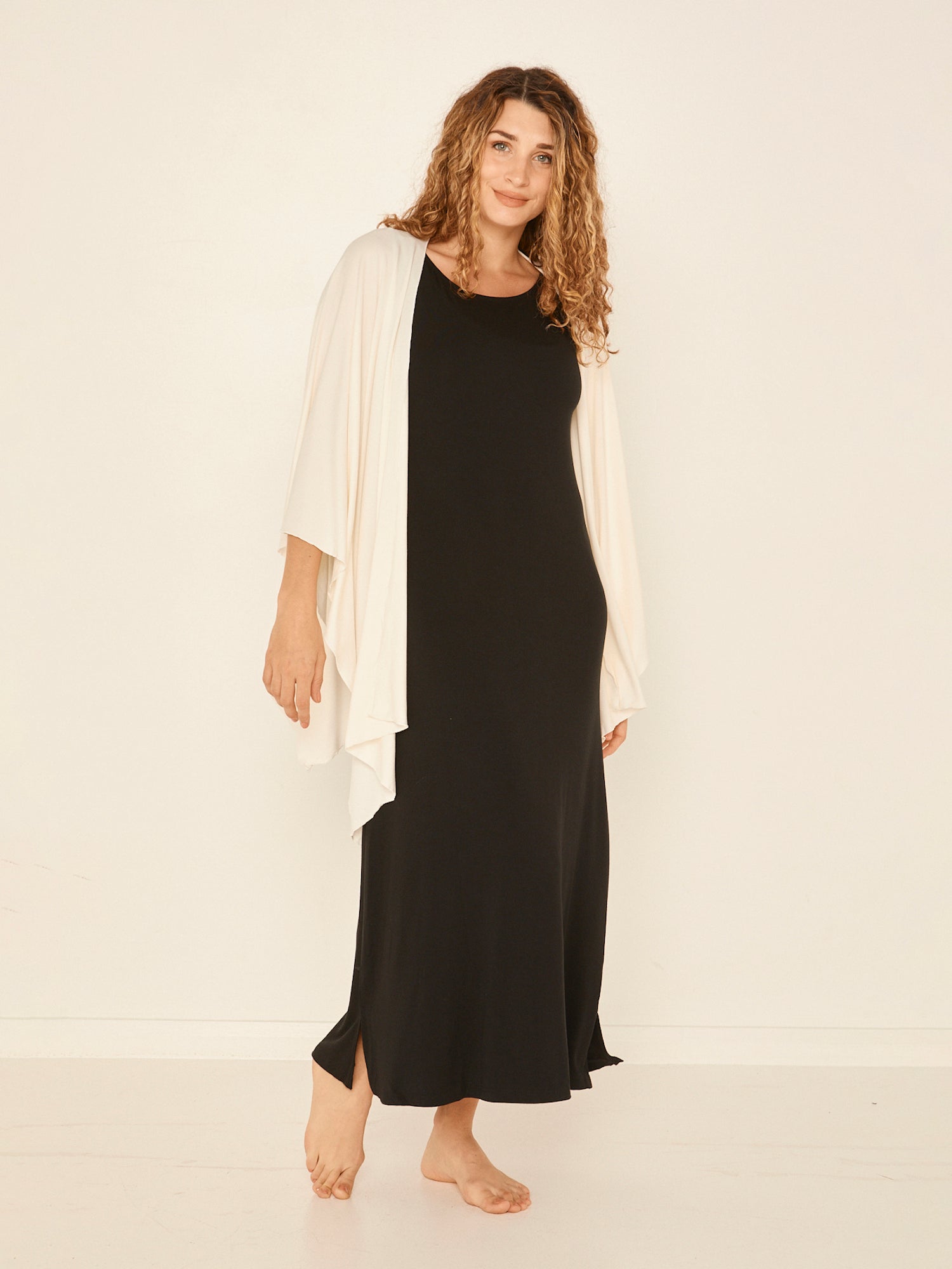 Model wearing cream large nourishing wrap, women's bamboo clothing