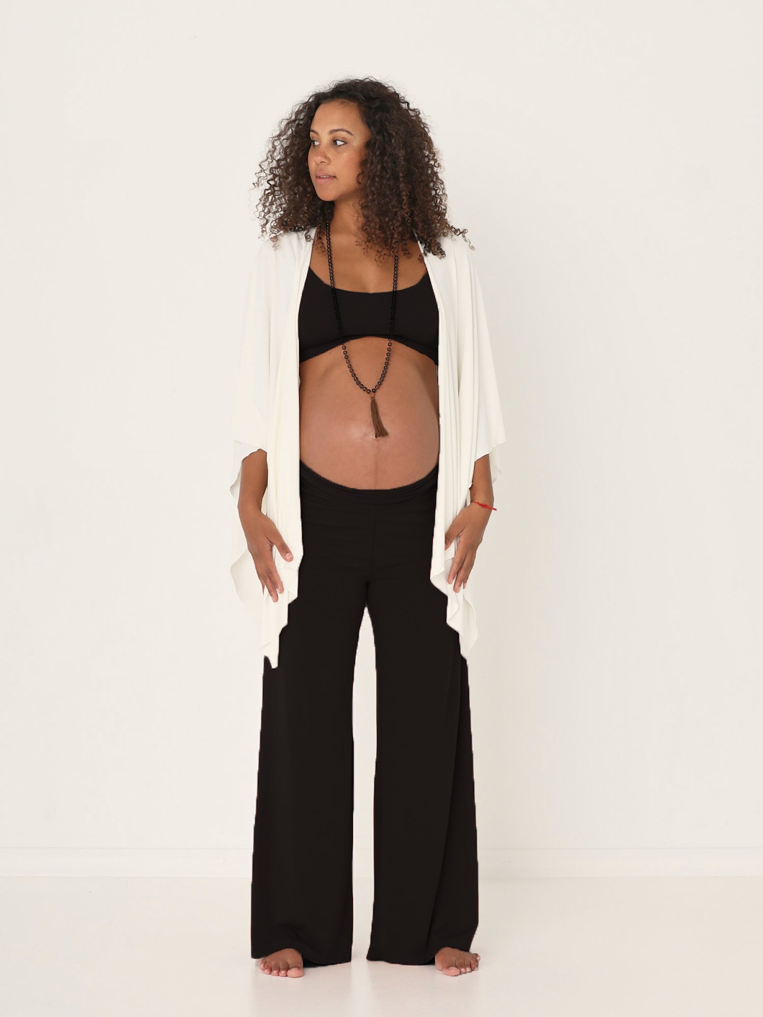 Model wearing cream large nourishing wrap, women's bamboo clothing