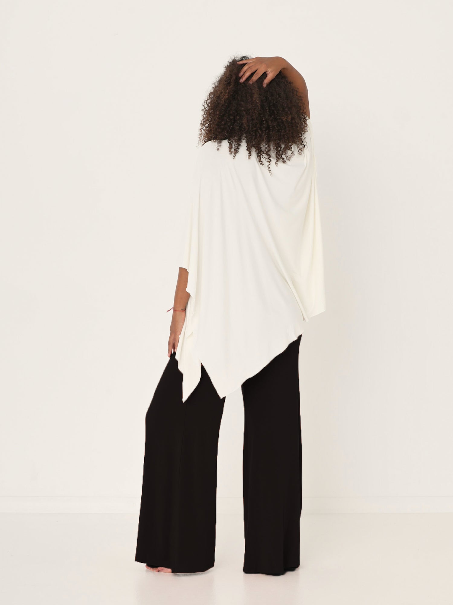 Model wearing cream large nourishing wrap, women's bamboo clothing
