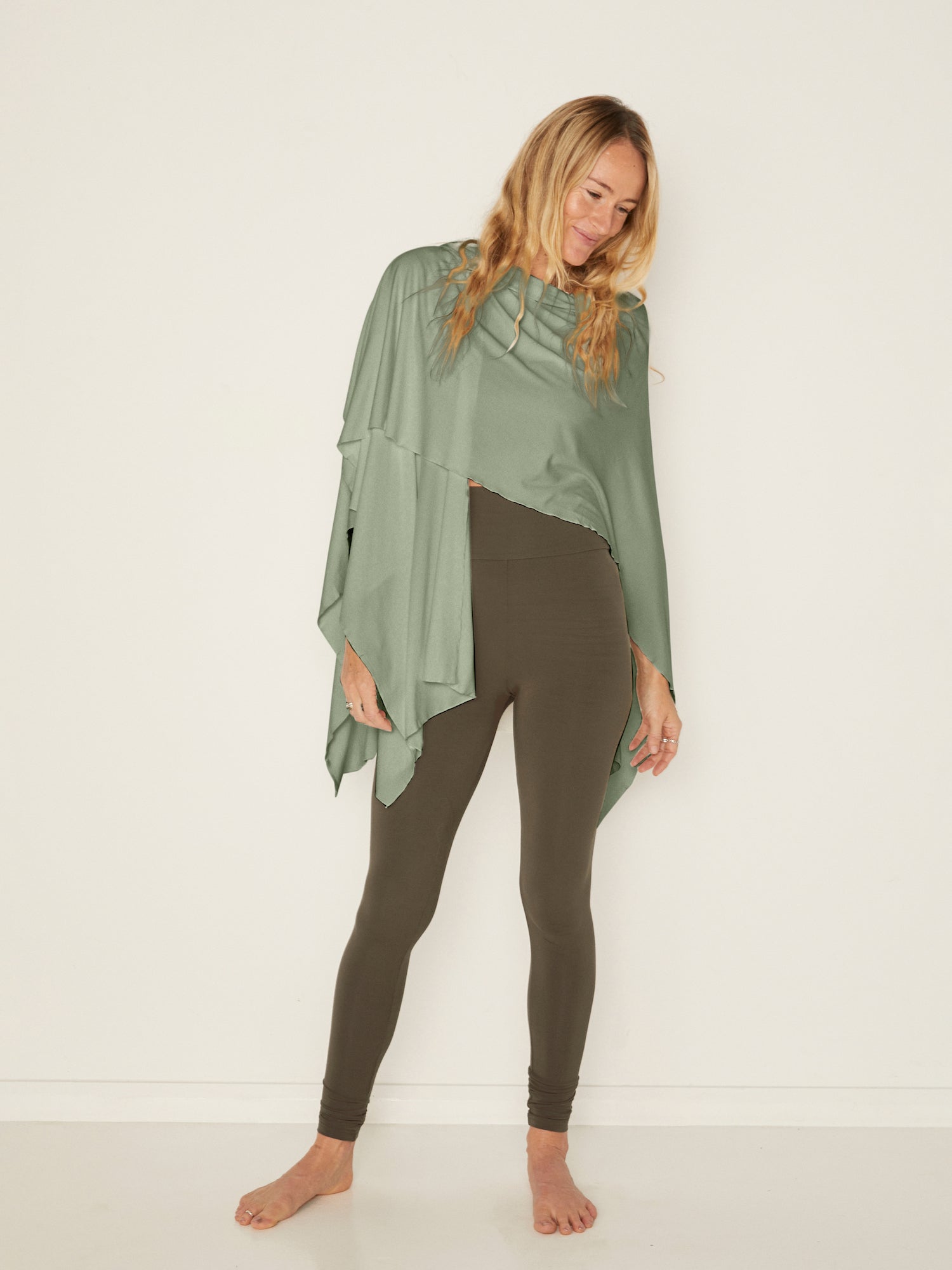 Model wearing eucalyptus green large nourishing wrap, women's bamboo clothing