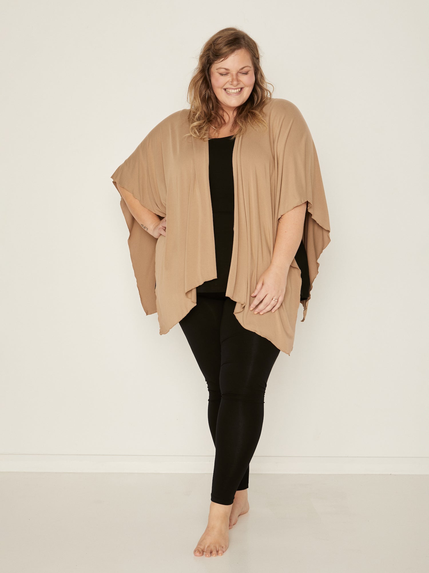 Model wearing black long ankle length tights, double layered high waistband, women's bamboo clothing