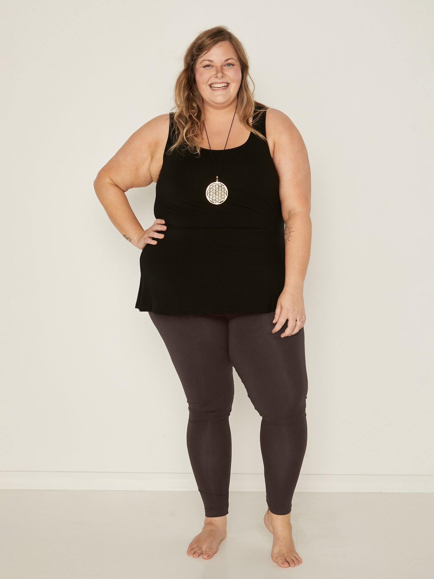 Model wearing cocoa brown long ankle length tights, double layered high waistband, women's bamboo clothing