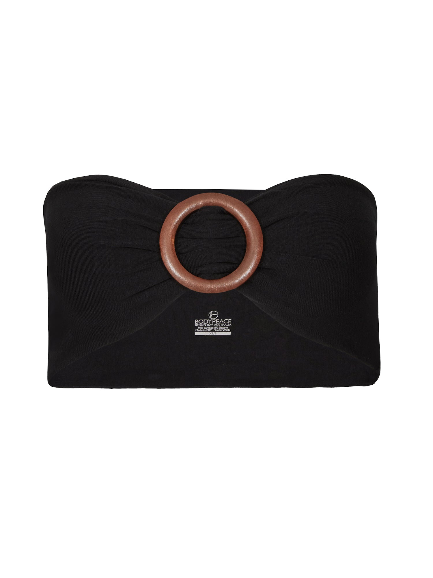 Model wearing black bamboo fabric belt with round natural brown wooden buckle, women's bamboo clothing accessories