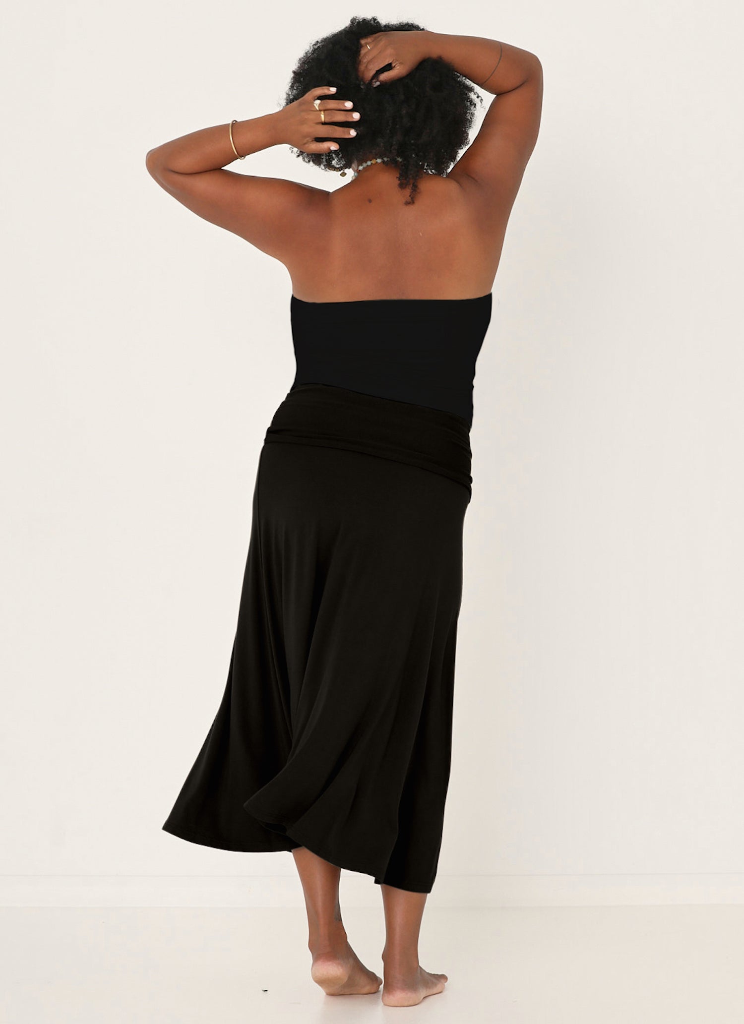 Model wearing black strapless boob tube top with supportive double layer fabric, women's bamboo clothing