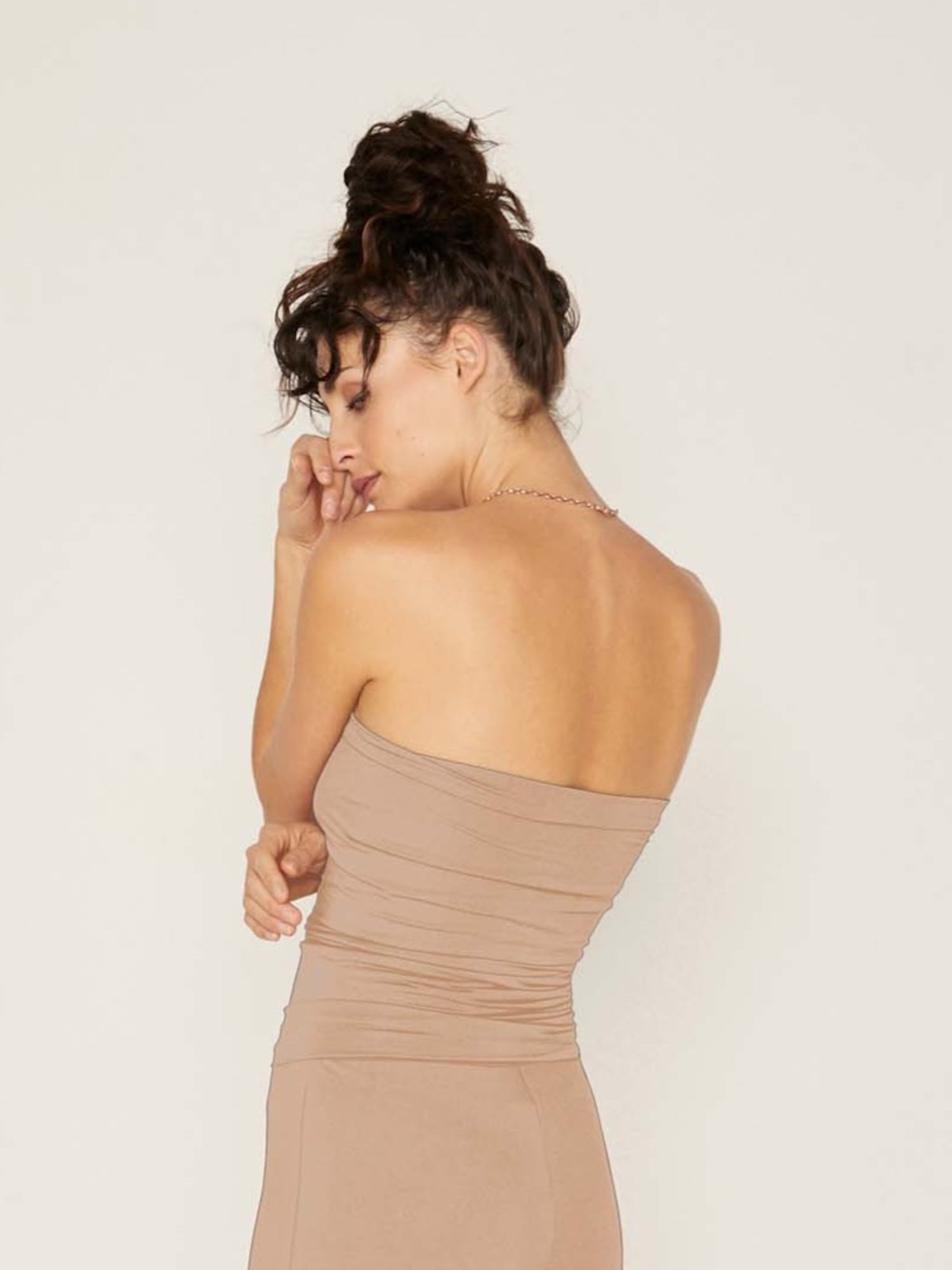 Model wearing caramel brown strapless boob tube top with supportive double layer fabric, women's bamboo clothing