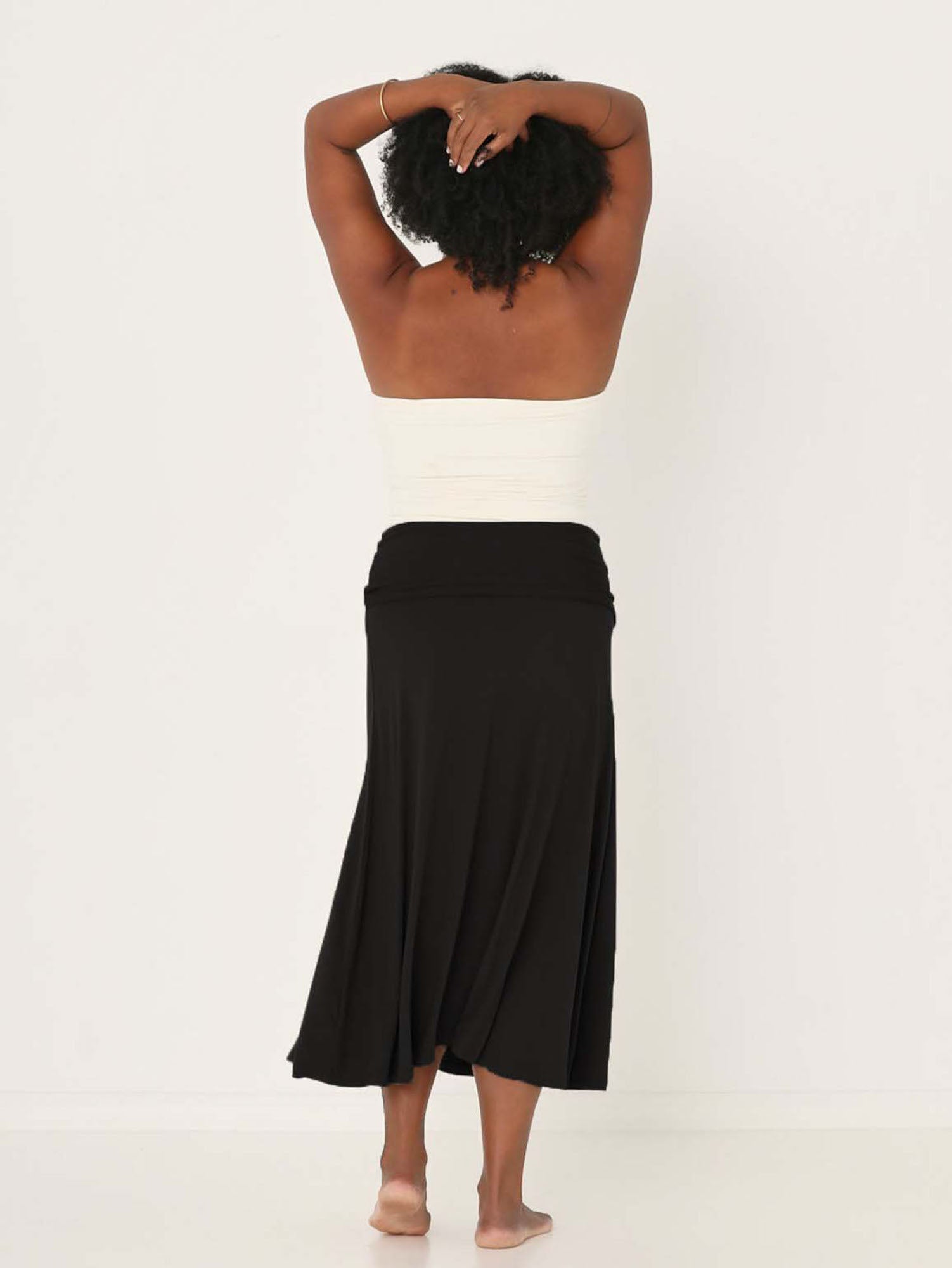 Model wearing cream strapless boob tube top with supportive double layer fabric with black swishy skirt, women's bamboo clothing