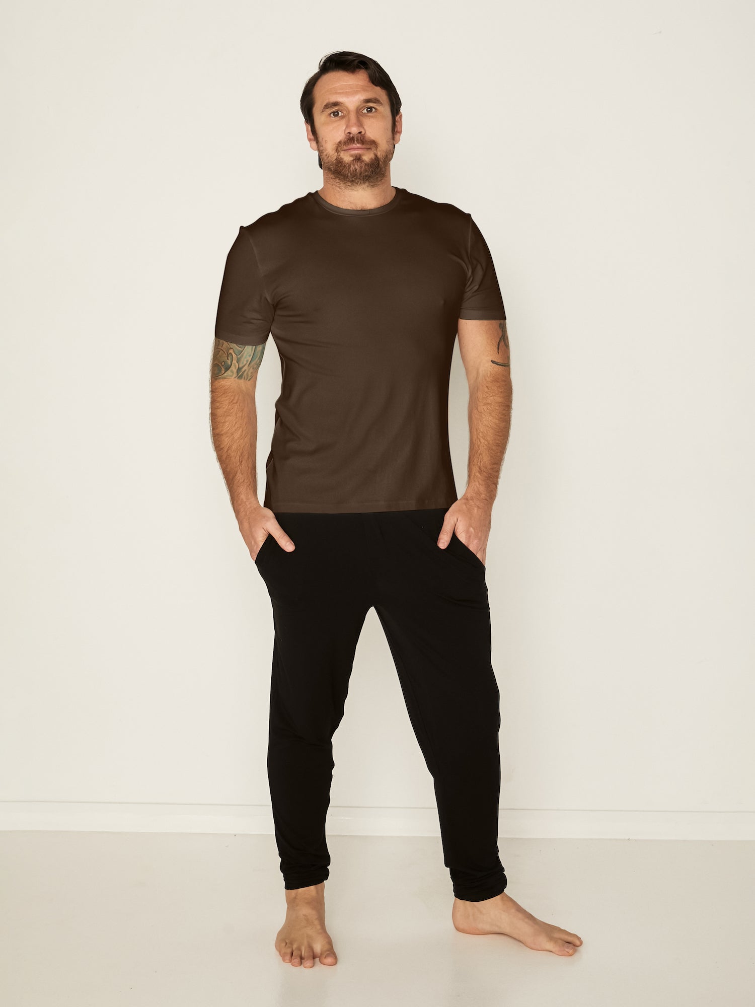 Male model wearing cocoa brown generous classic fit tee, soft neckband, crew neckline, short sleeve, men's bamboo clothing