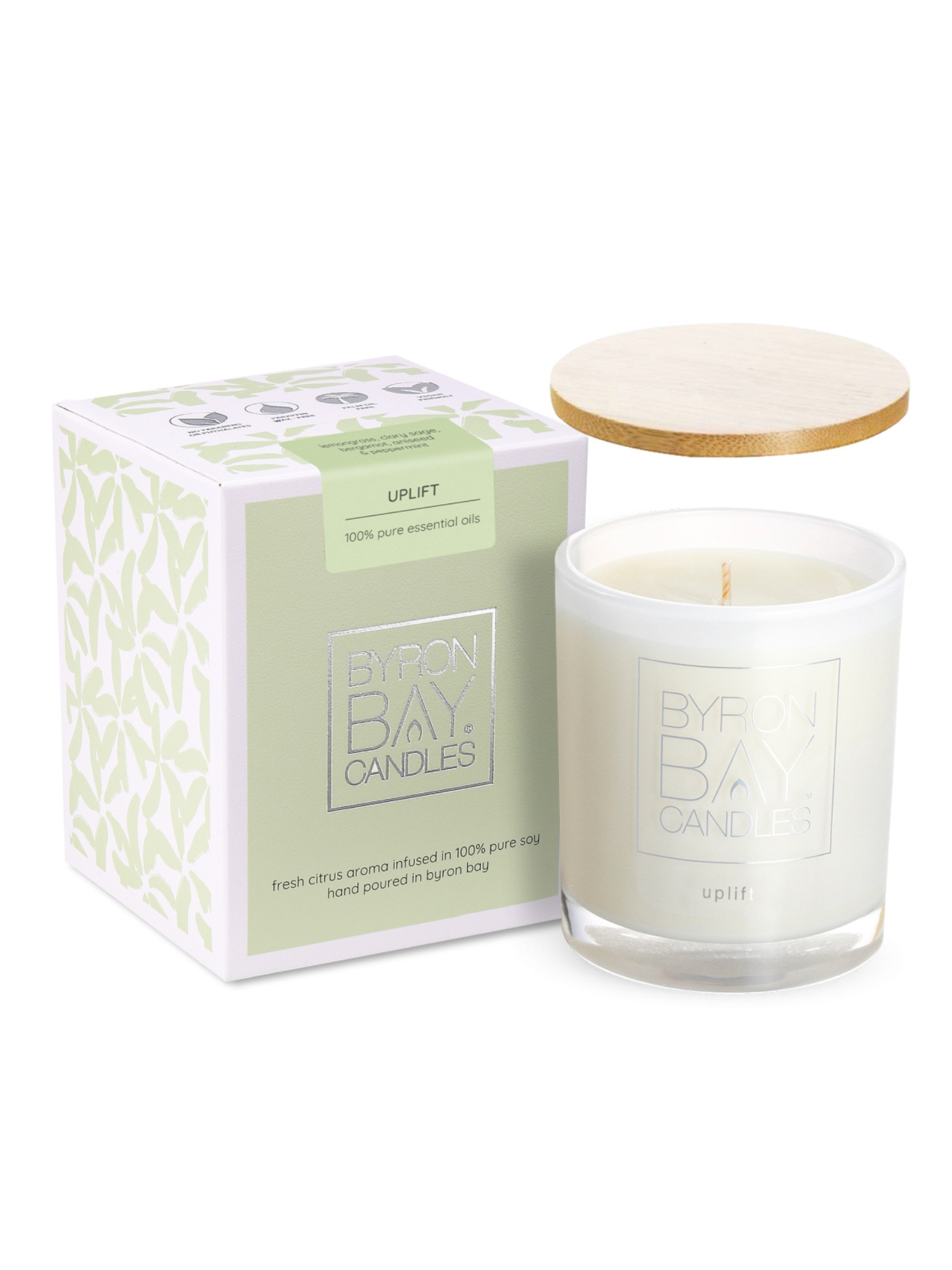 Byron Bay Uplift essential oil Candle with wooden lid and packaging on a white background
