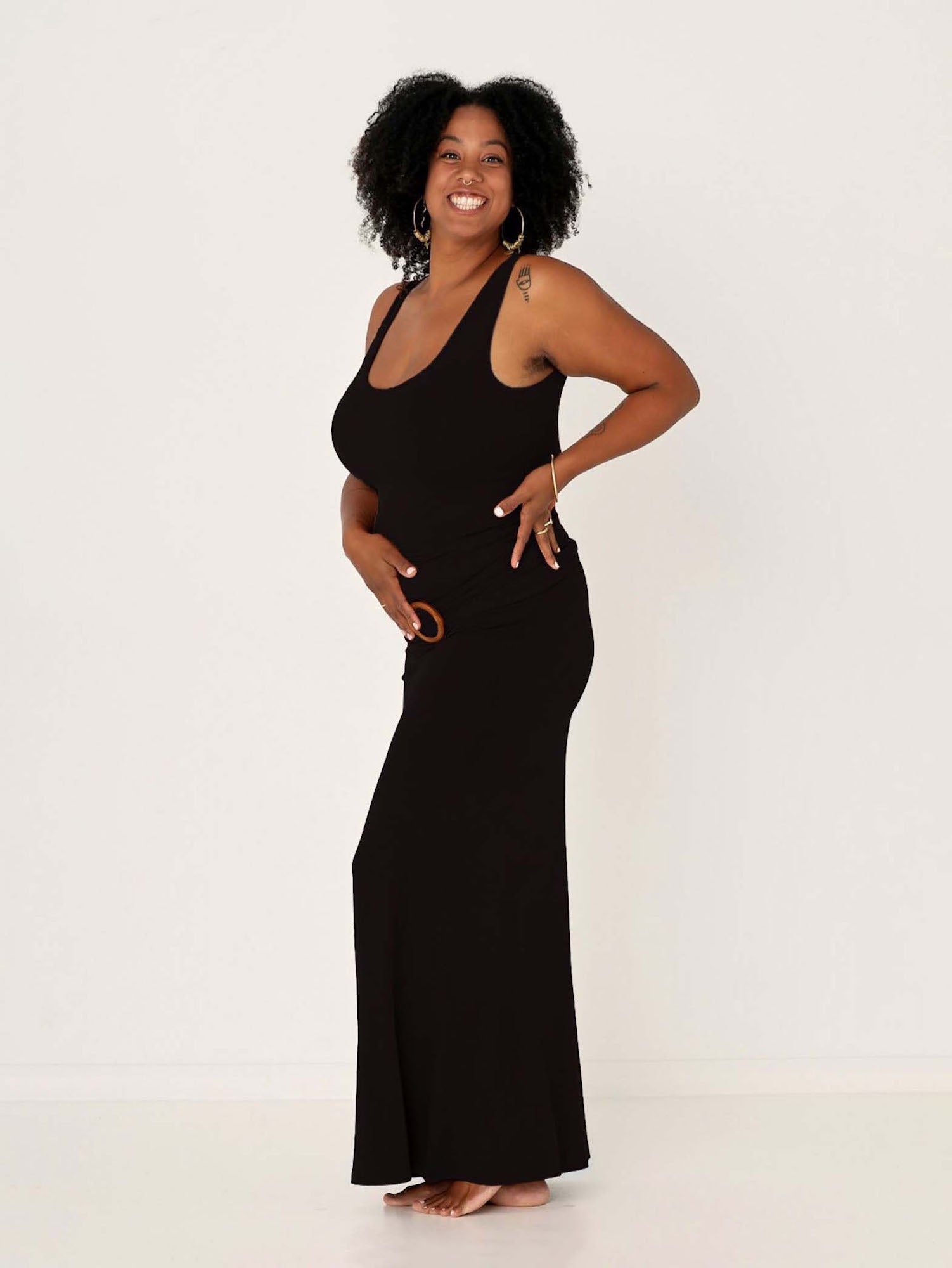 model wearing a long black maxi length skirt with classic singlet, women's bamboo clothing