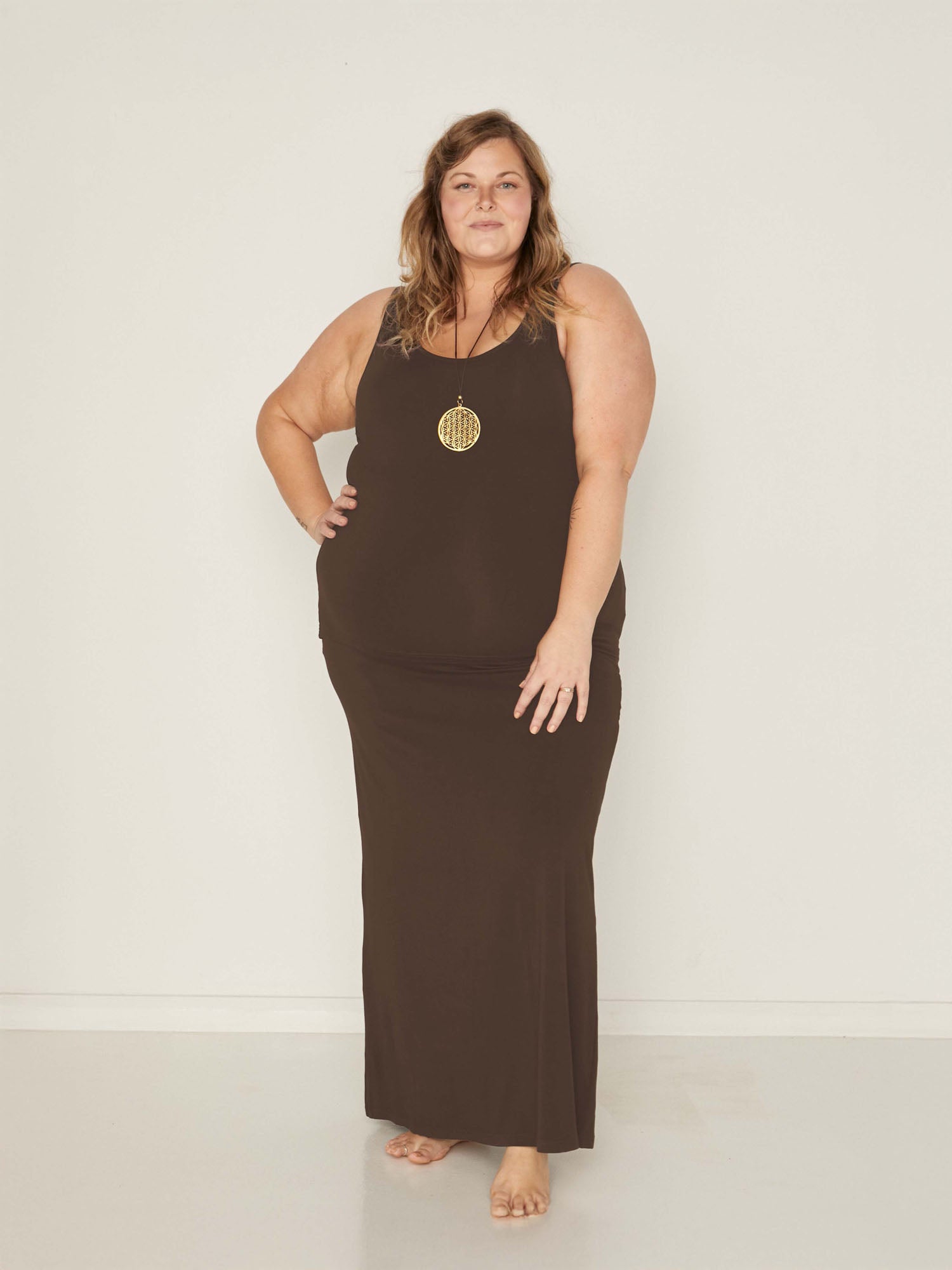 model wearing a long cocoa maxi length skirt, with classic singlet, women's bamboo clothing