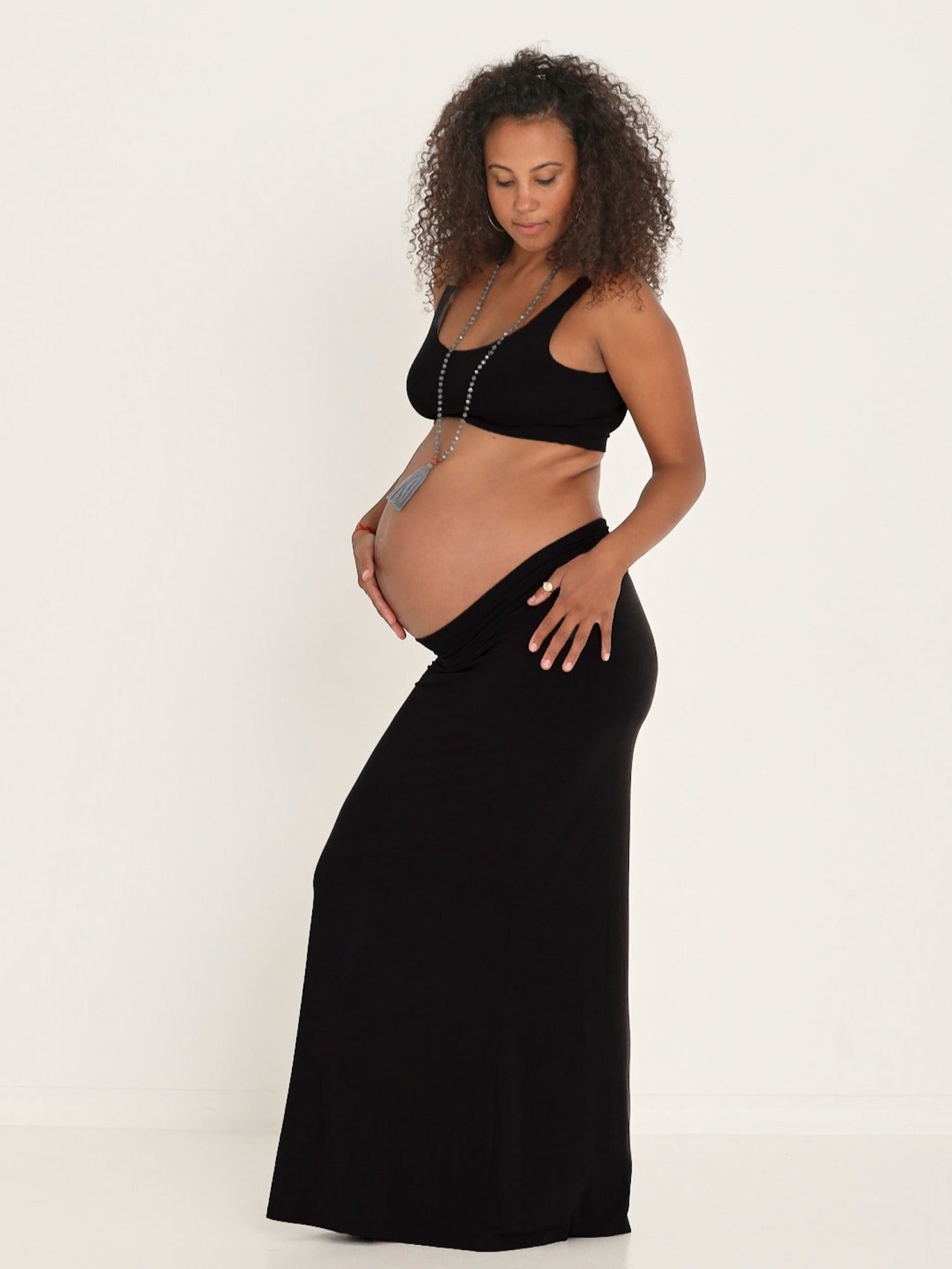 model wearing a long black maxi length skirt, women's bamboo clothing