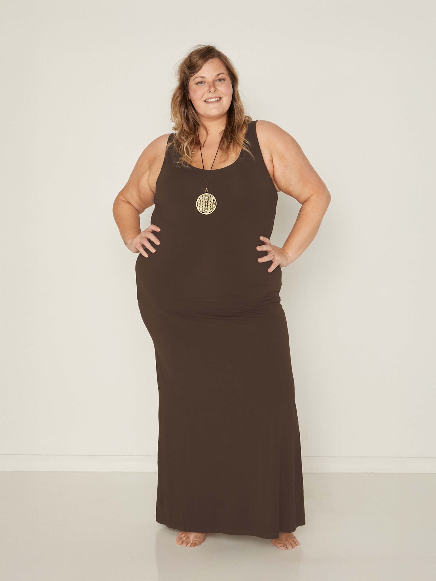 model wearing a long cocoa maxi length skirt, with classic singlet, women's bamboo clothing