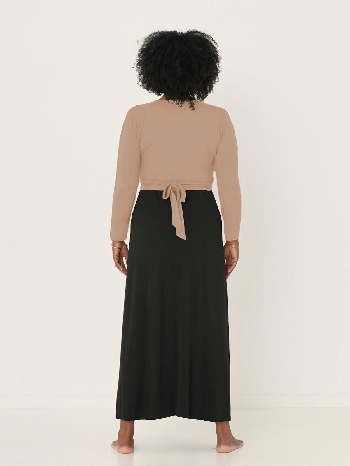 Model wearing a caramel brown ballet wrap cardigan with plunge neckline and fitted long sleeves, women's bamboo clothing
