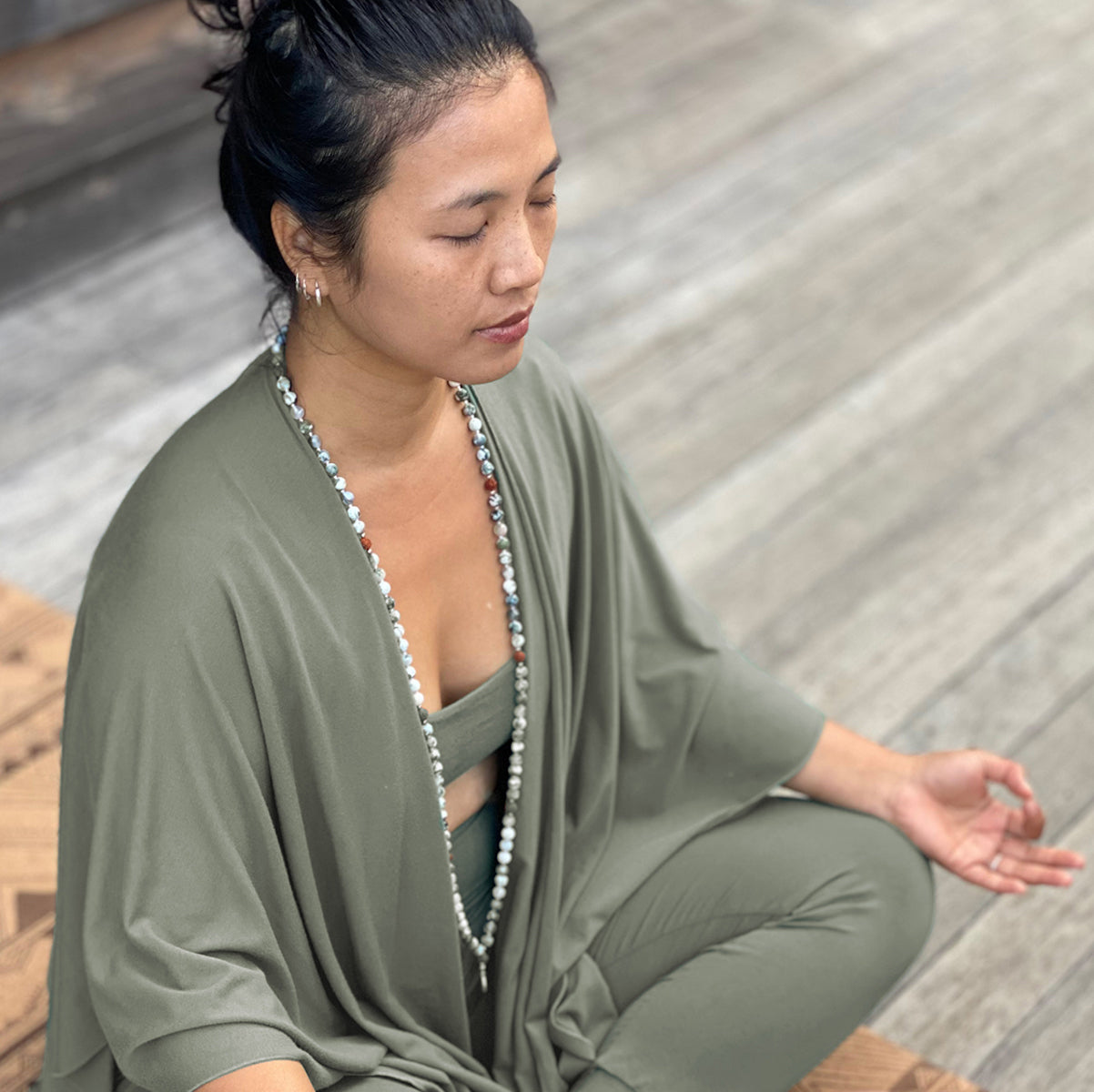 Woman meditating wearing bamboo bra, tights and nourishing wrap