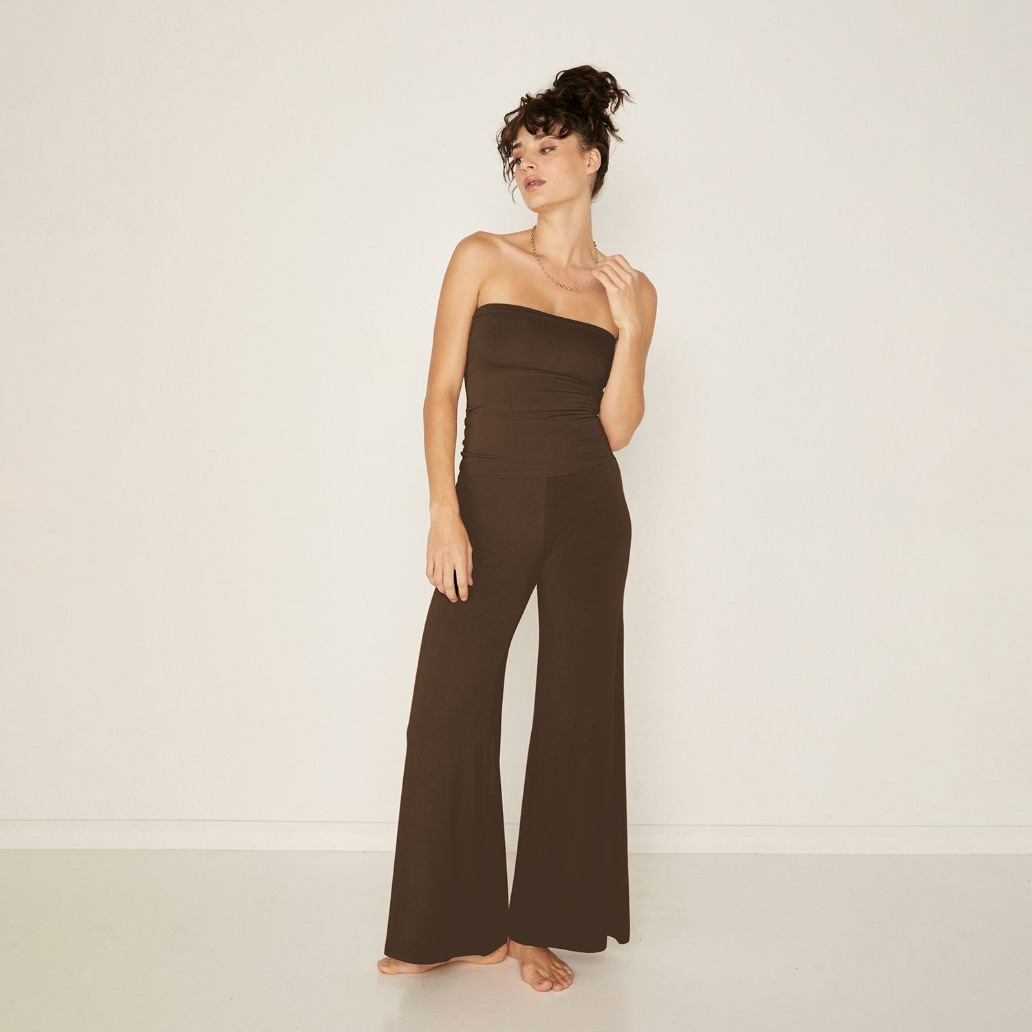 Model wears cocoa bamboo palazzo pants and tube top