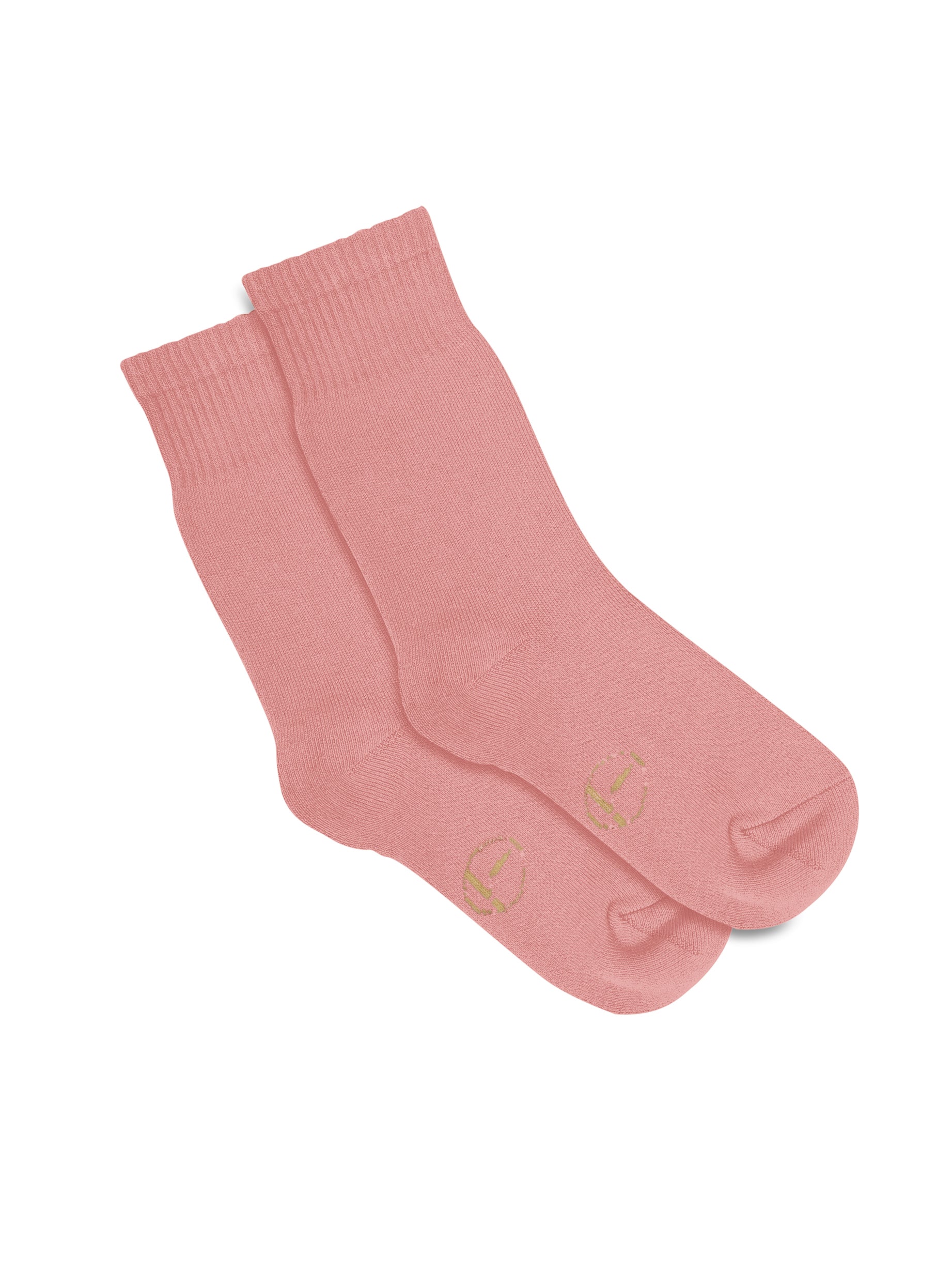 Model wearing dusty pink mid rise thick work, hiking, bed socks with ribbed top and thick cushioned sole, bamboo socks