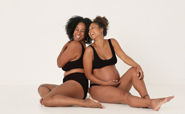 Models wearing bamboo black knickers and bra