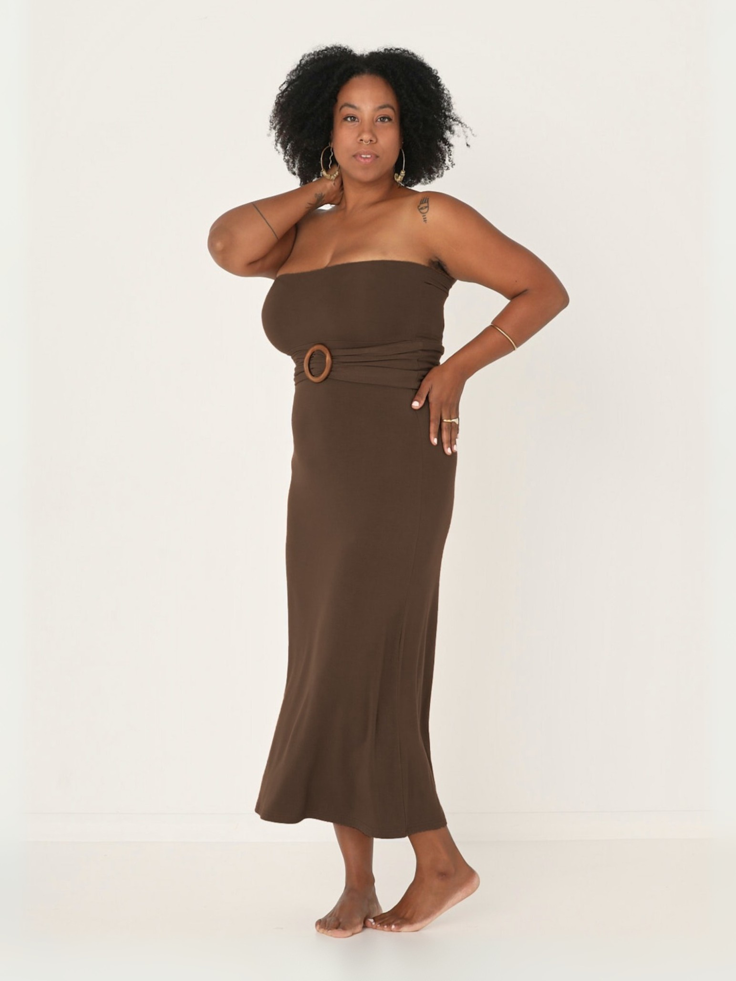 model wearing a long cocoa brown maxi length skirt, worn as a strapless dress with belt, women's bamboo clothing
