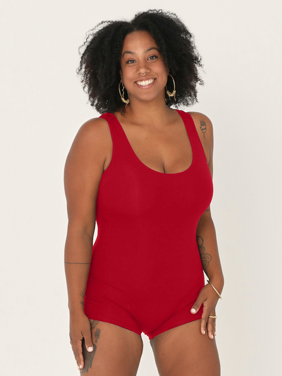 Woman wearing reversible chili red boyleg bodysuit with scoop and boat necklines, women's bamboo clothing