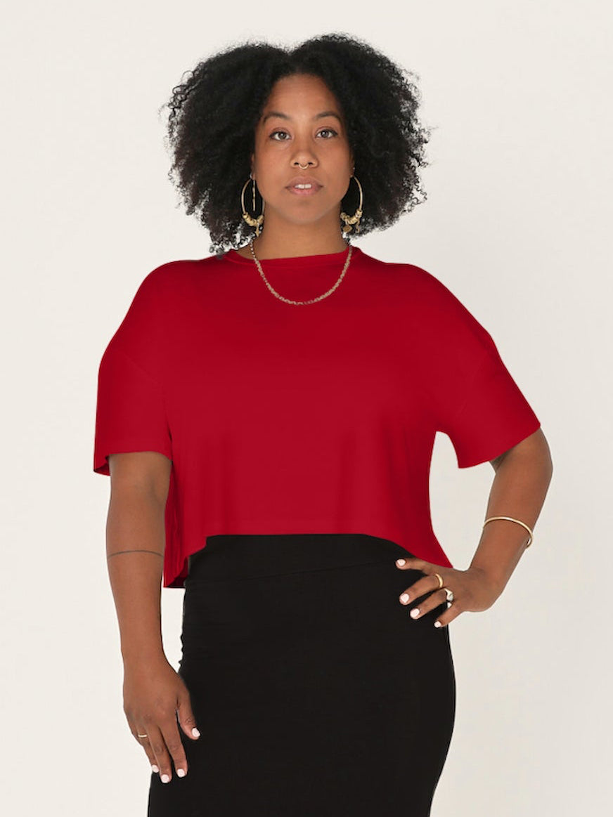 Model wears chili pepper red bamboo lounge tee in a crew neck style with a slight crop length and a black tube pencil skirt, womens bamboo clothing