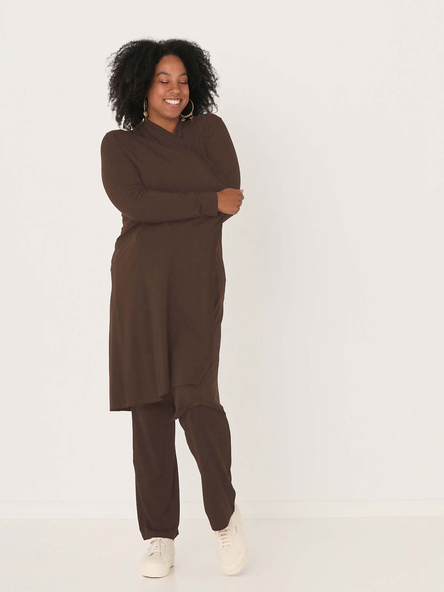 Model wearing cocoa brown long cardigan, below knee length jacket with long fitted sleeves, women's bamboo clothing