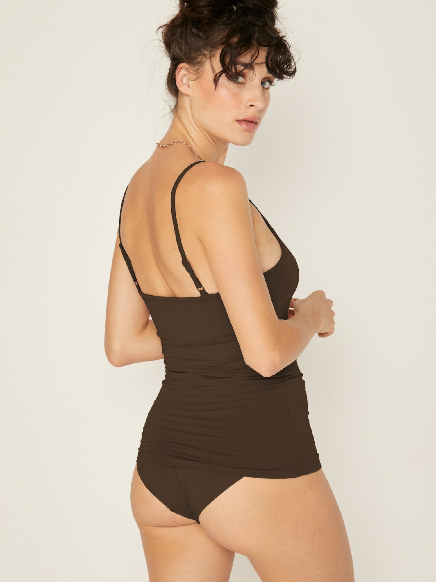Woman wearing cocoa brown body singlet with in-built bralette, subtle v front and adjustable straps, women's bamboo clothing