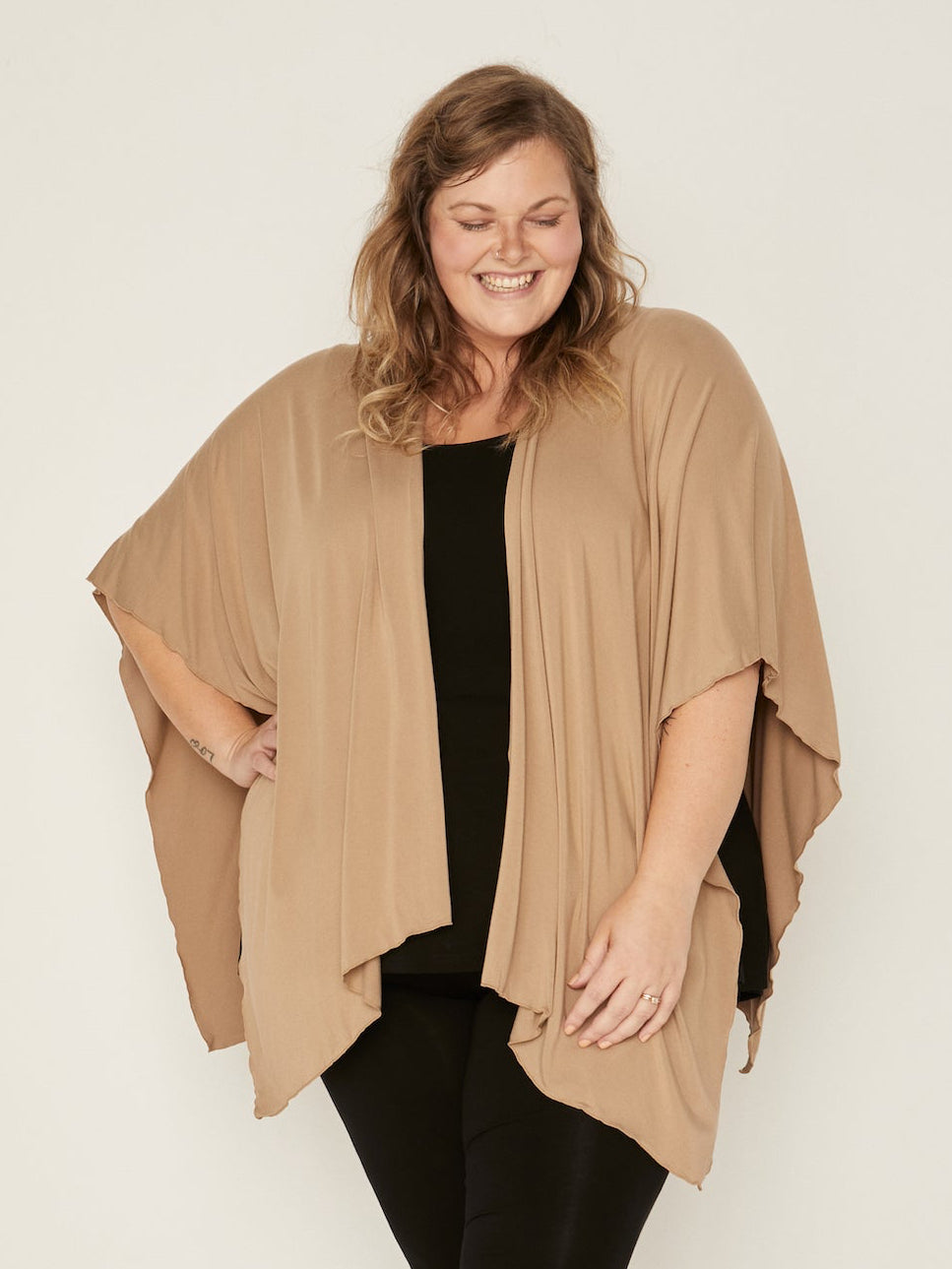 Model wearing caramel brown large shawl, nourishing wrap, women's bamboo clothing