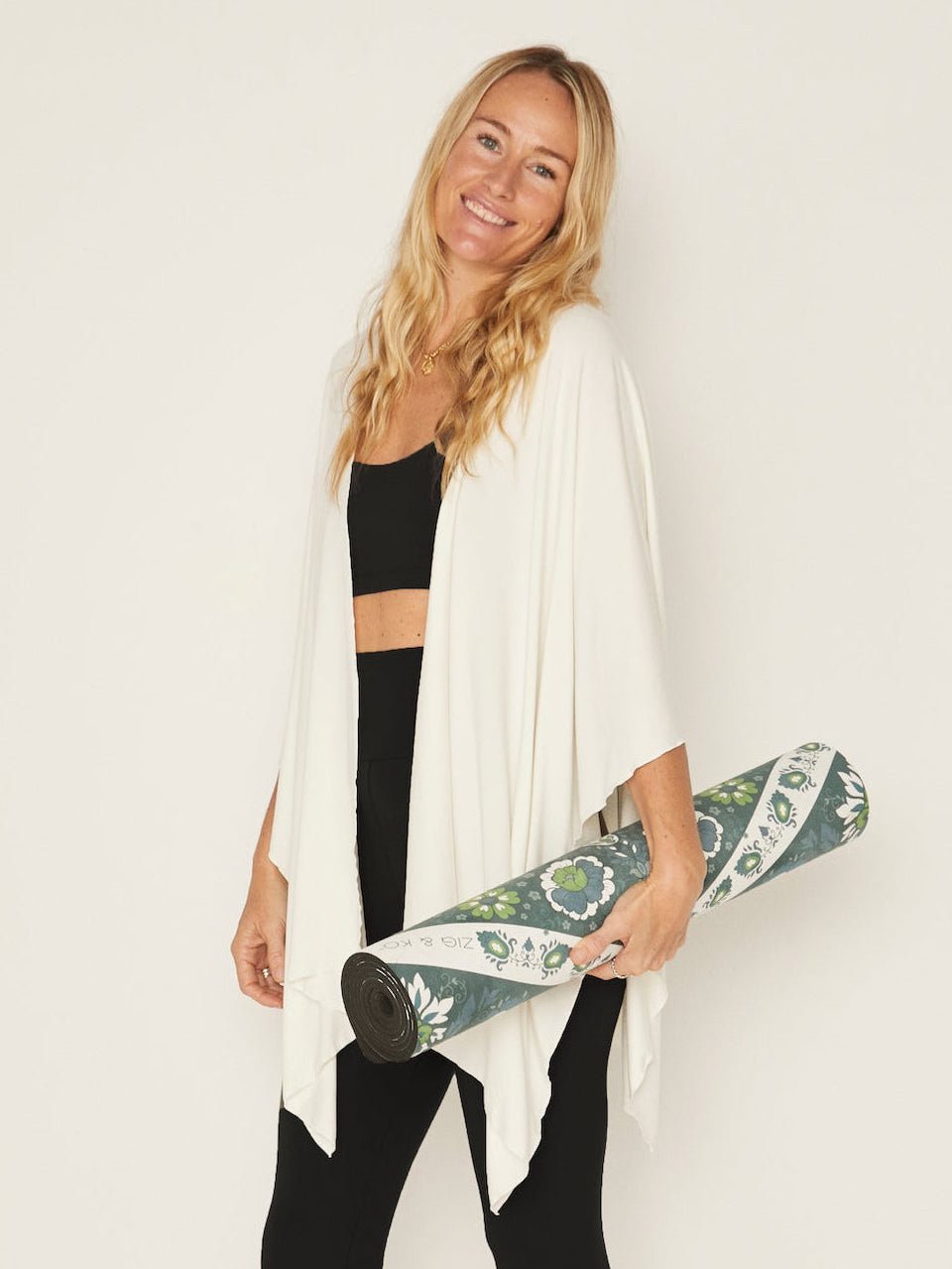 Model wearing cream large nourishing wrap, women's bamboo clothing