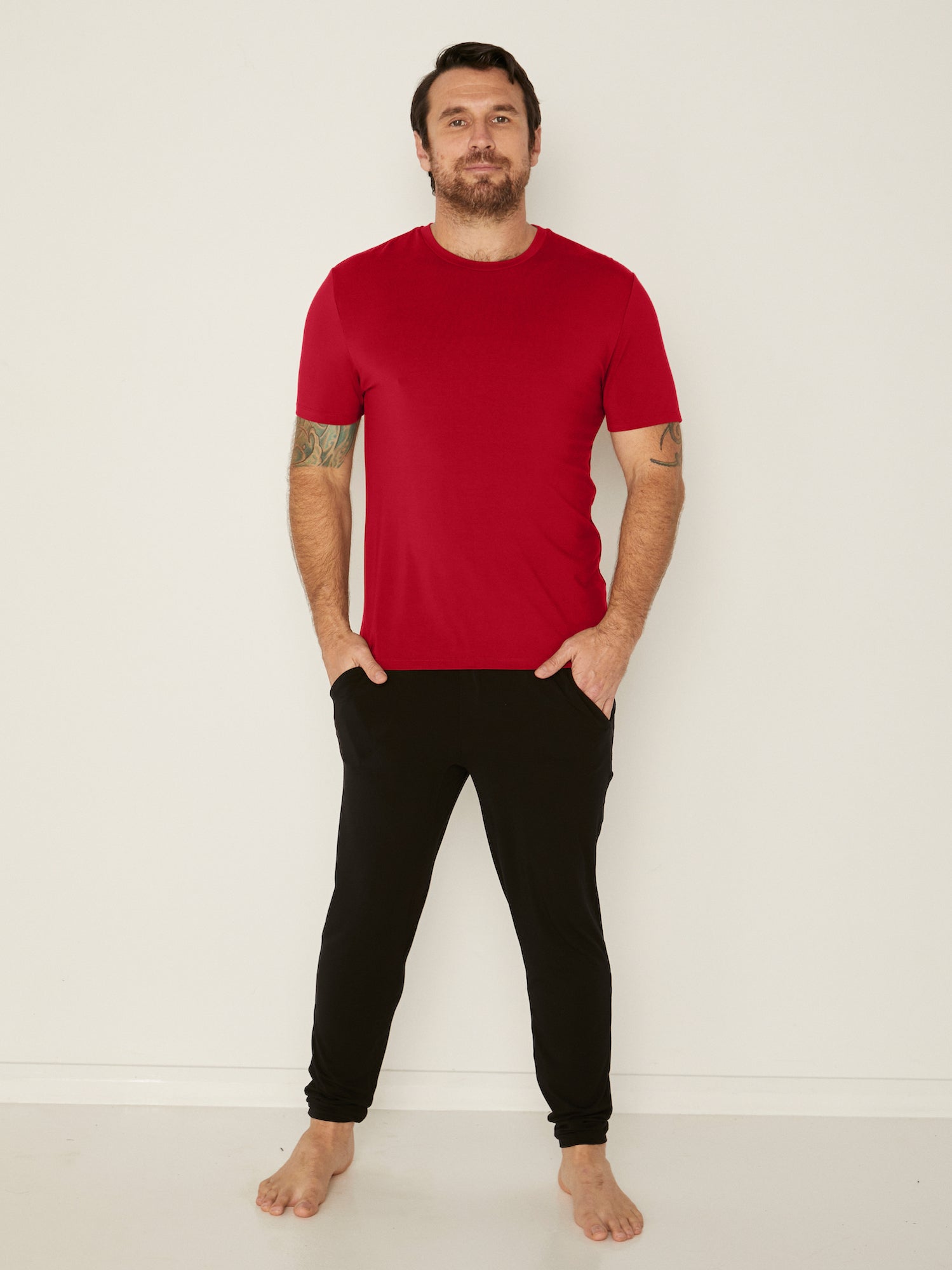 Male model wearing chili red generous classic fit tee, soft neckband, crew neckline, short sleeve, men's bamboo clothing