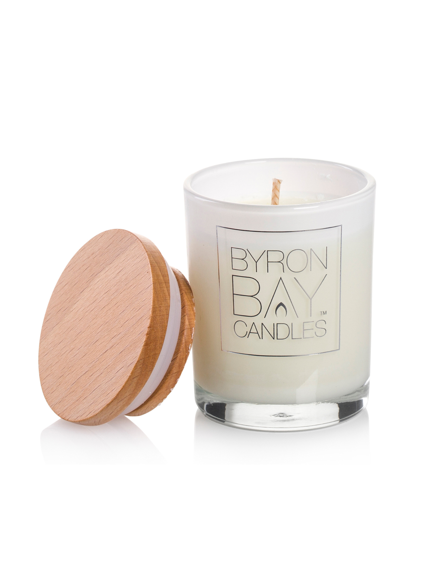 Candle with a wooden lid on a white background, branded 'Byron Bay Candles'.